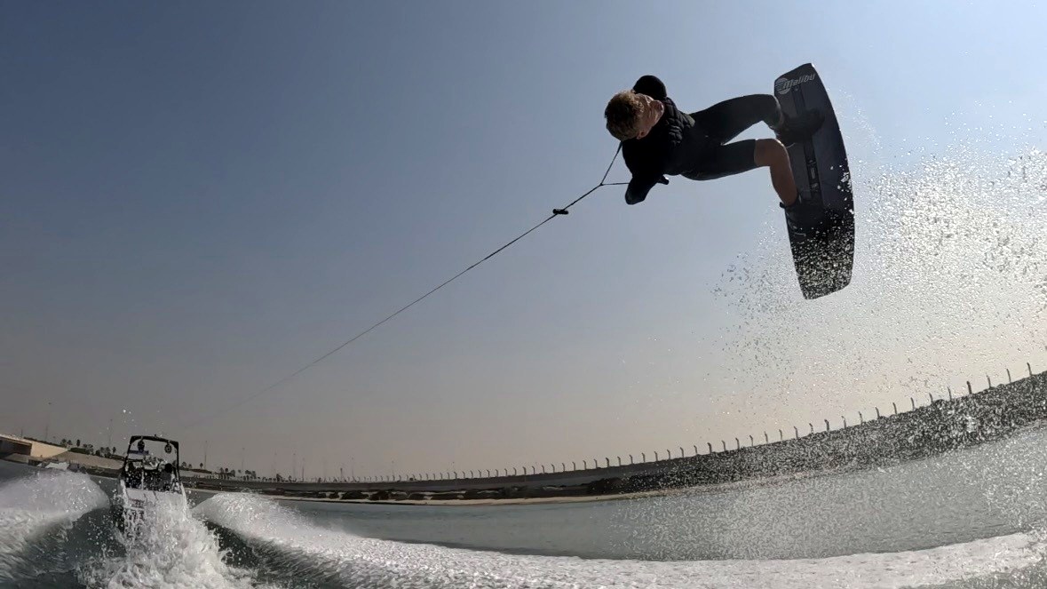 Eywoa wakeboarder catching big air behind the boat near Yas Island Abu Dhabi