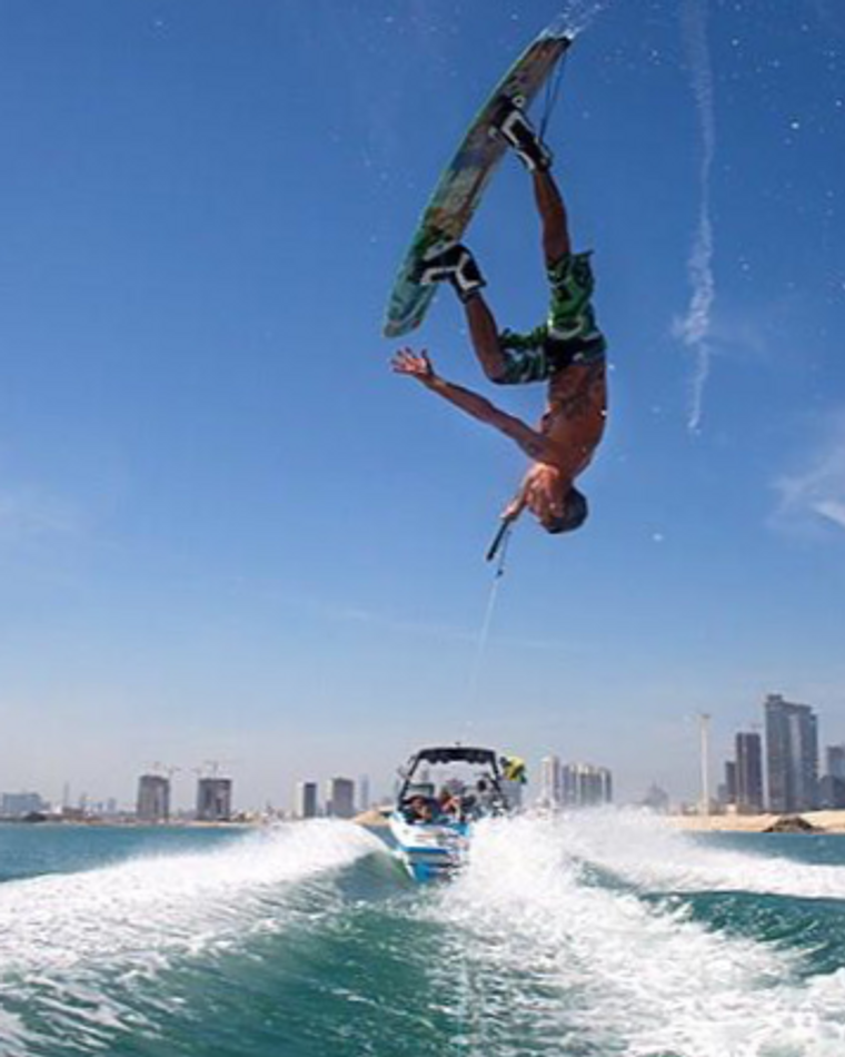 Eywoa wakeboarder going high off the wake near Yas Island